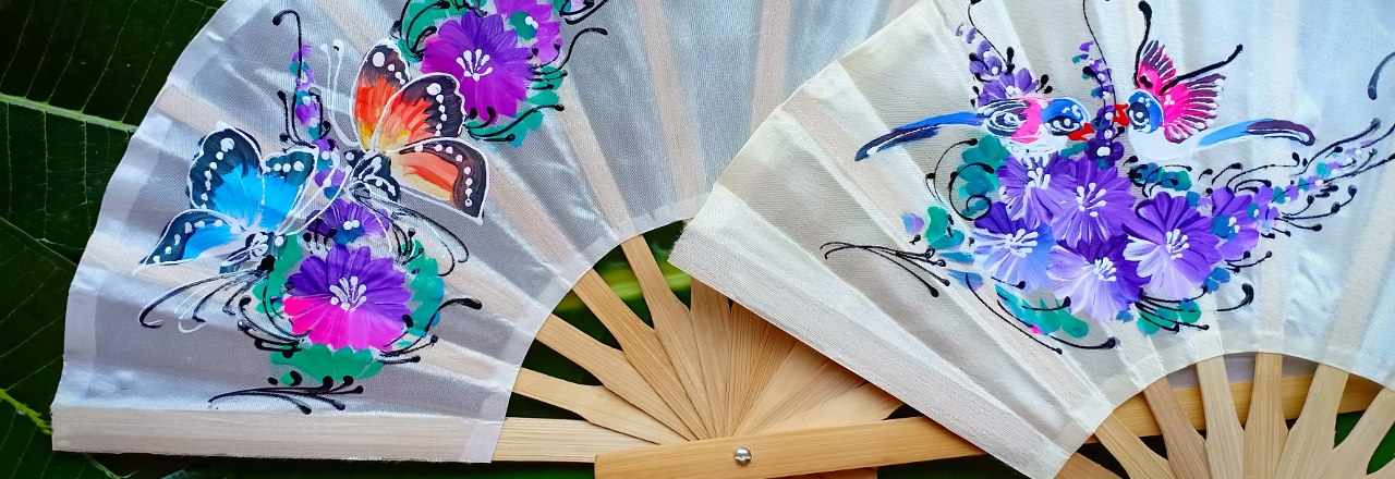 Two hand painted silky fabric wedding fans, with with matching themes flowers butterflies birds