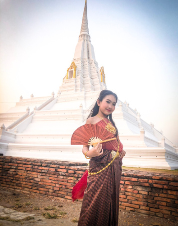 Ms Cartoon with wedding fan at Wat Chaiwatthanaram Ayutthaya, Thailand